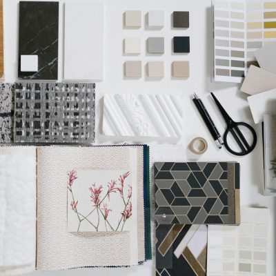 A flat lay of interior design samples showcasing textures and colors for creative inspiration.